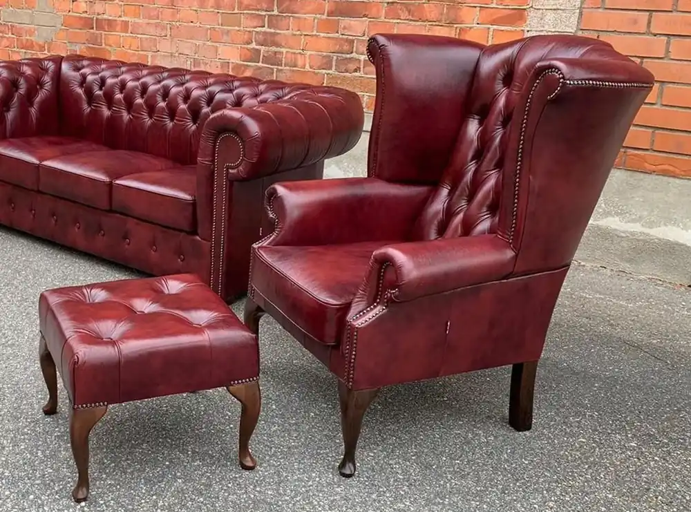 Neue Kollektion Casa Padrino luxury Chesterfield leather wing armchair with stool bordeaux red