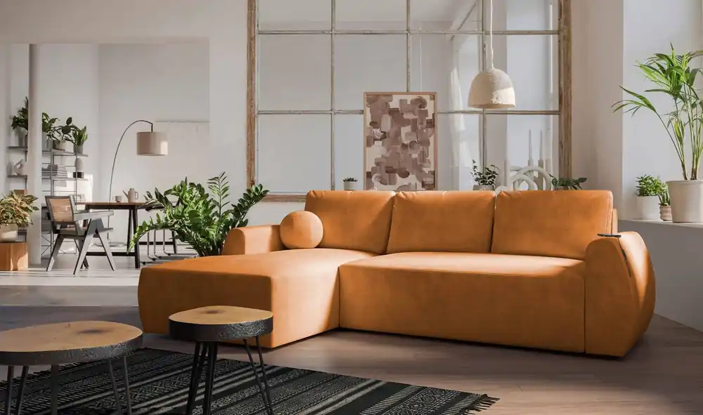 Super-Preis Ecksofa mit Schlaffunktion Colio honey linke Seite stilvolles Ecksofa mit interessanter Form Velourstoff Zierkissen Ball